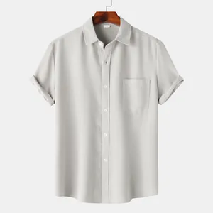 Close-up detail of grey waffle textured men's short sleeve casual button-down shirt.