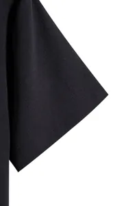 Detail shot of a black short sleeve showing high-quality fabric texture and stitching