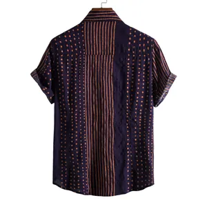Back view of men's navy short-sleeved shirt with brown vertical stripes and polka dot print
