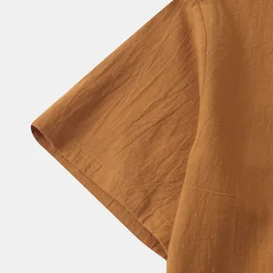 Detailed macro view of men's cotton linen short sleeve shirt showing the fabric texture