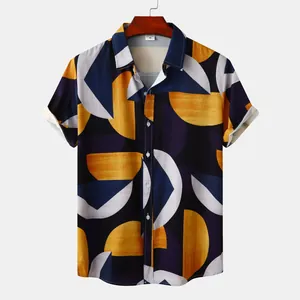 Detail shot of men's geometric print short sleeve beach shirt with navy and yellow patterns