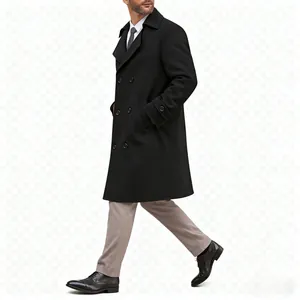 Side view of a man wearing a classic black double-breasted wool overcoat in a walking pose.