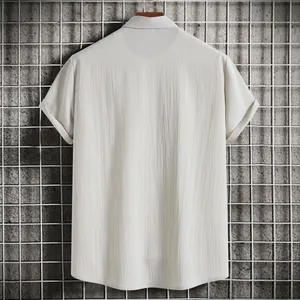 Back view of a men's short-sleeved shirt featuring textured, breathable fabric.