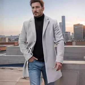 Professional male model wearing a premium light gray mid-length wool coat on a rooftop