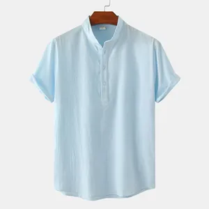 Detail of light blue men's cotton linen henley shirt with stand collar and buttons