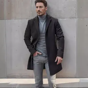 Full-length view of a men's stylish black wool overcoat over a grey turtleneck