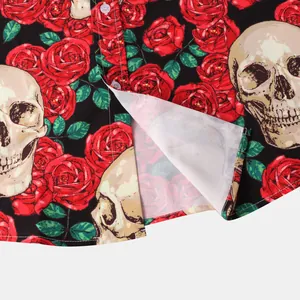 Detail of men's Halloween shirt featuring realistic skull and red rose prints on fabric.