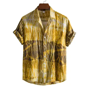 Detailed view of yellow and brown tie-dye pattern on men's casual short-sleeve shirt