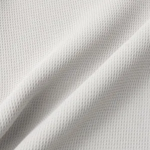 Close-up of breathable waffle texture fabric on men's casual solid summer shirt
