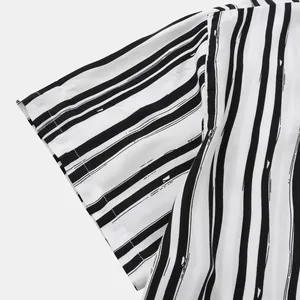 Detail shot of black and white irregular stripes on casual short sleeve shirt