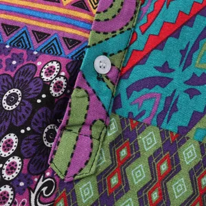 Close-up of vibrant ethnic pattern and texture on men's casual Hawaiian short sleeve shirt