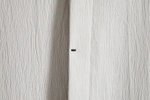 Detailed close-up showing the textured seersucker fabric and stitching of a men's shirt