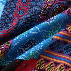 Detailed close-up of vibrant ethnic bohemian pattern on men's Hawaiian shirt fabric.