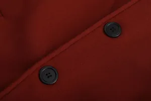 Close-up of black buttons and thick burgundy wool fabric on a men's winter coat