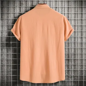 Back view of a men's peach short sleeve shirt featuring textured fabric detail
