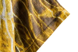 Close-up of abstract wavy pattern and fine stitching on a men's summer casual floral shirt