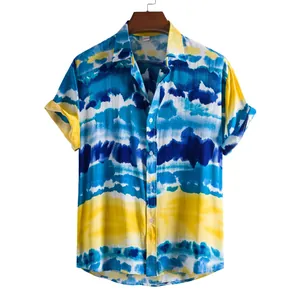 Detail view of colorful blue and yellow tie-dye patterns on men's short sleeve shirt