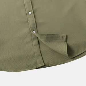 Close-up of olive green waffle texture men's casual button-down shirt hem detail