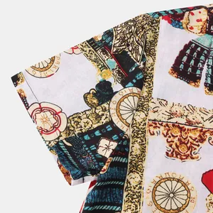 Detail view of men's Hawaiian short sleeve shirt showing vibrant vintage patterns