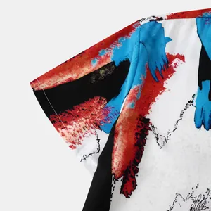 Close-up detail of men's short sleeve shirt with vibrant abstract artistic print