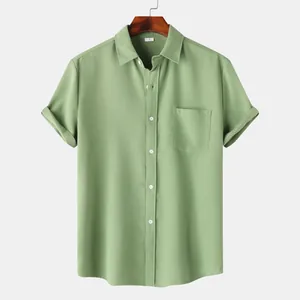 Close-up of a men's sage green textured waffle knit short sleeve button-down shirt
