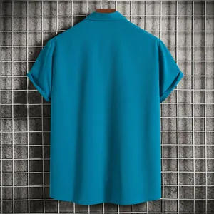 Detailed back view of a plain blue men's short-sleeve summer shirt with textured fabric