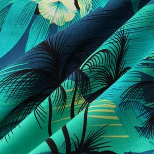 Close-up detail of breathable cotton-linen tropical palm tree print fabric for summer beach shorts