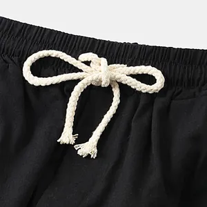 Close-up detail of men's breathable cotton linen shorts with white braided drawstring