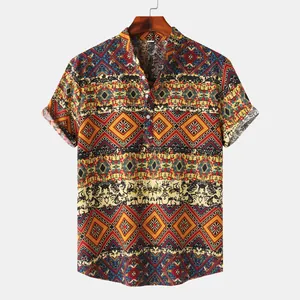Detail view of men's short sleeve shirt with vibrant ethnic Hawaiian print and stand collar.