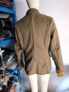 Detailed back view of a classic brown wool-blend jacket for women on a white mannequin