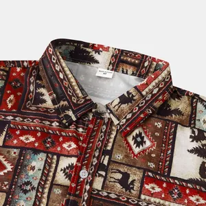 Close-up detail of men's short-sleeve beach shirt with vintage tribal and nature prints.