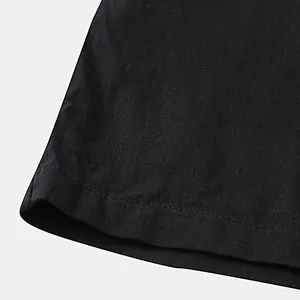 Close-up of double-stitched hem on high-quality black cotton-linen casual pants