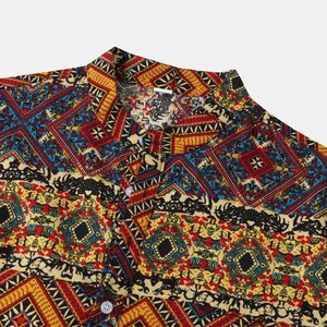 Close-up of men's Hawaiian shirt collar showing intricate ethnic geometric print.