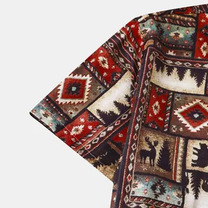 Close-up of men's short sleeve shirt featuring vintage tribal elk and tree patterns.