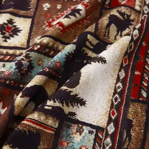 Close-up of retro ethnic print fabric for men's beach shirt with elk and tree patterns