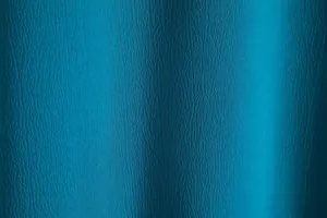 Macro view of the teal blue textured fabric for this men's summer short-sleeve shirt.