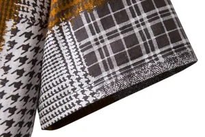 Close-up detail of checkered pattern on men's cotton linen casual shirt sleeve hem.