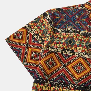 Macro detail showing the ethnic geometric print and fabric of men's summer shirt