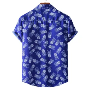 Back view of classic men's blue Hawaii short sleeve shirt featuring white pineapple print