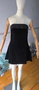 Sexy black velvet strapless tube top mini dress displayed on a mannequin model