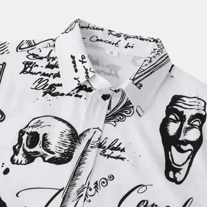 Close-up detail of white men's Halloween shirt featuring black skull and mask prints
