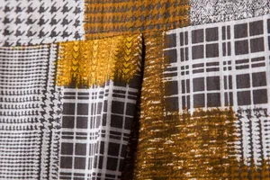 Close-up detail of retro patchwork pattern and stitching on casual linen texture shirt