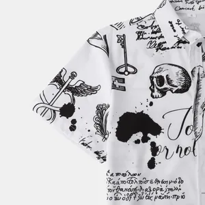 Close-up of gothic skull and script print on white men's short sleeve shirt