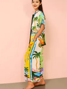 Colorful tropical print short-sleeve vacation pajama set featuring palm tree patterns