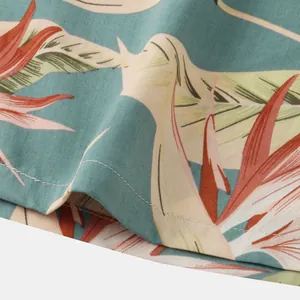 Macro view of vibrant tropical floral print on breathable cotton linen beach shorts fabric