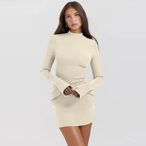 Elegant beige long-sleeved slim fit mini dress with high neck and flared cuffs details