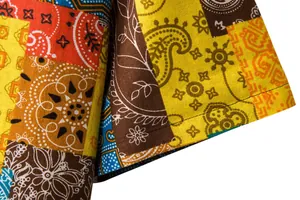 Close-up of vibrant ethnic patchwork patterns and texture on men's linen shirt sleeve