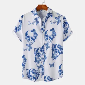 Detailed view of blue skull and butterfly print on men's white short-sleeved beach shirt