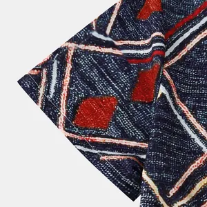 Macro detail of geometric print and woven texture on men's holiday beach shirt sleeve.