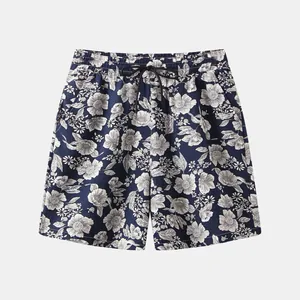Men's navy blue floral print beach shorts featuring a comfortable drawstring waist detail
